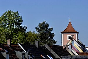 The tower is visible over the roofs of the city